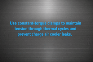 Minimalist vector graphic with gunmetal background and bright blue text reading “Use constant-torque clamps to maintain tension through thermal cycles and prevent charge air cooler leaks.”